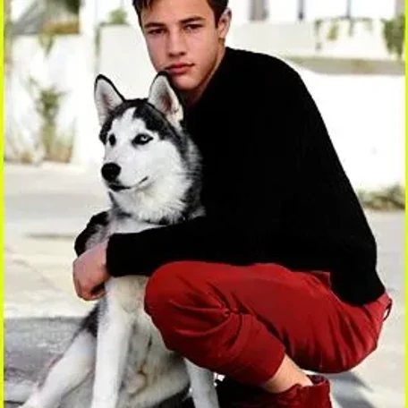 Cameron Dallas poses with his new dog Jaxx during his photo shoot for the Just Jared Spotlight Series.