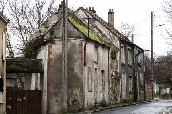 A quiet lane of old houses now small factories